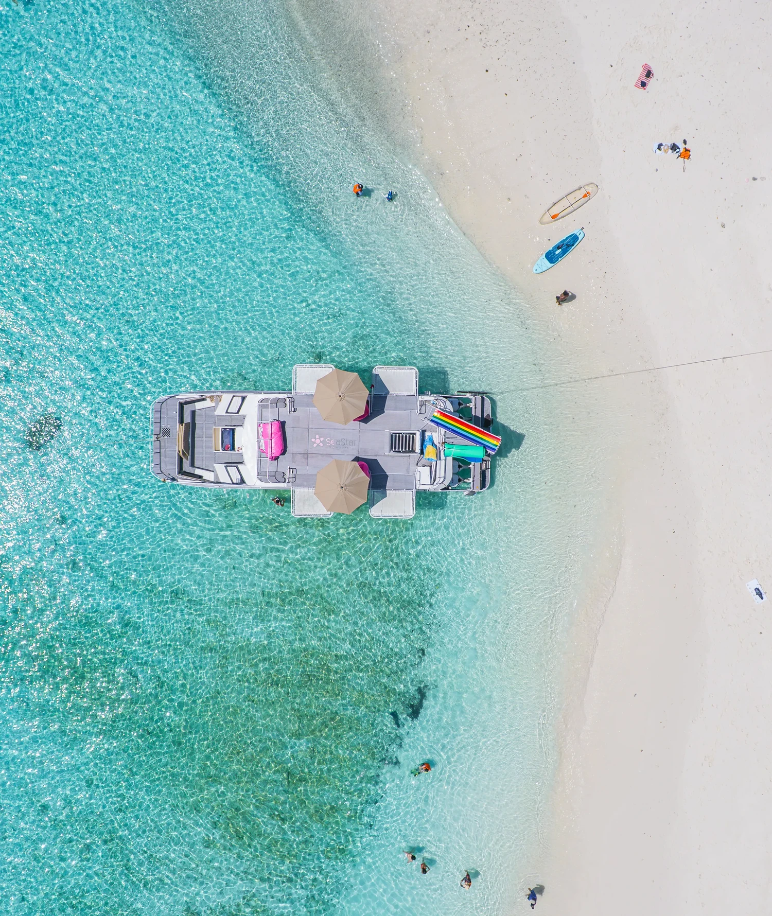 Aerial view of a white beach and turquoise water at the Racha Islands