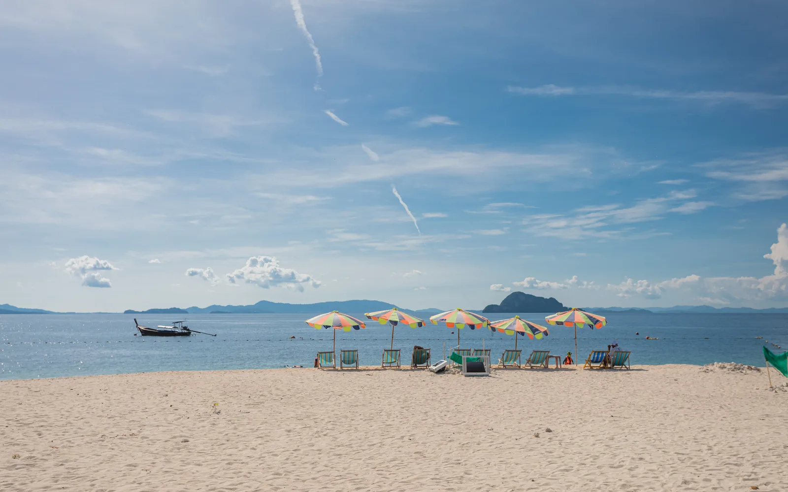 White sand and colourful umbrellas at Khai Island